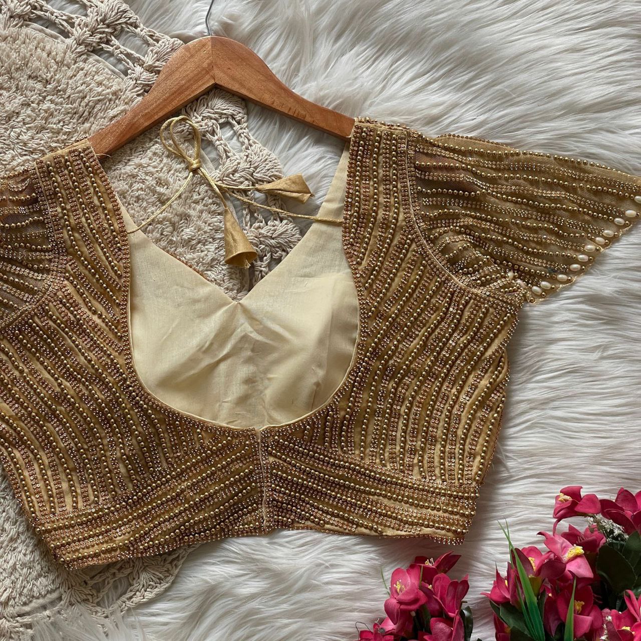 Presenting beautiful handcrafted pearl work in all over front and back of the blouse