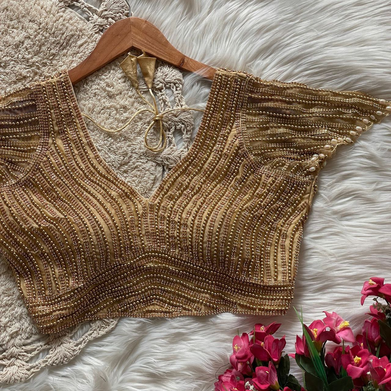 Presenting beautiful handcrafted pearl work in all over front and back of the blouse