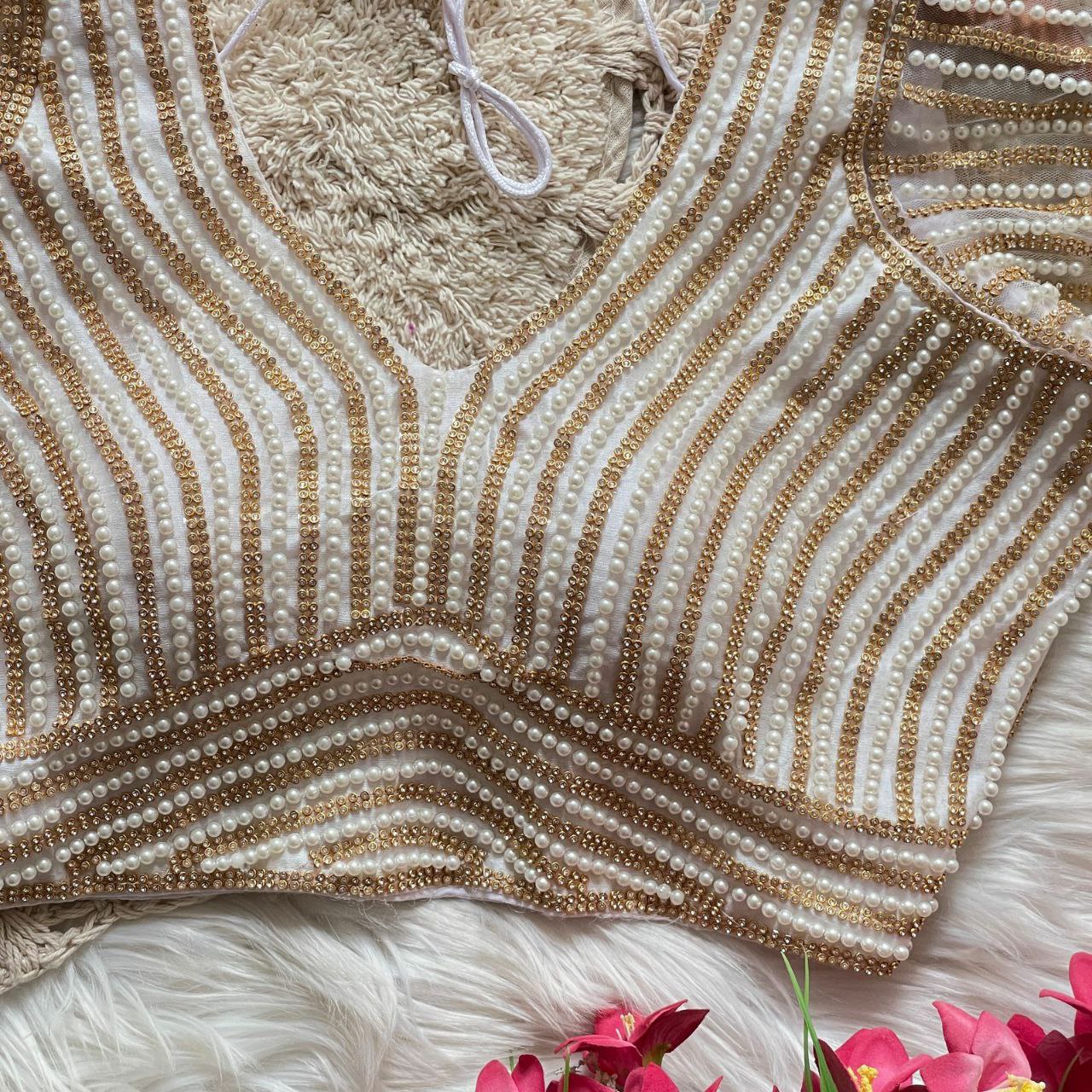 Presenting beautiful handcrafted pearl work in all over front and back of the blouse
